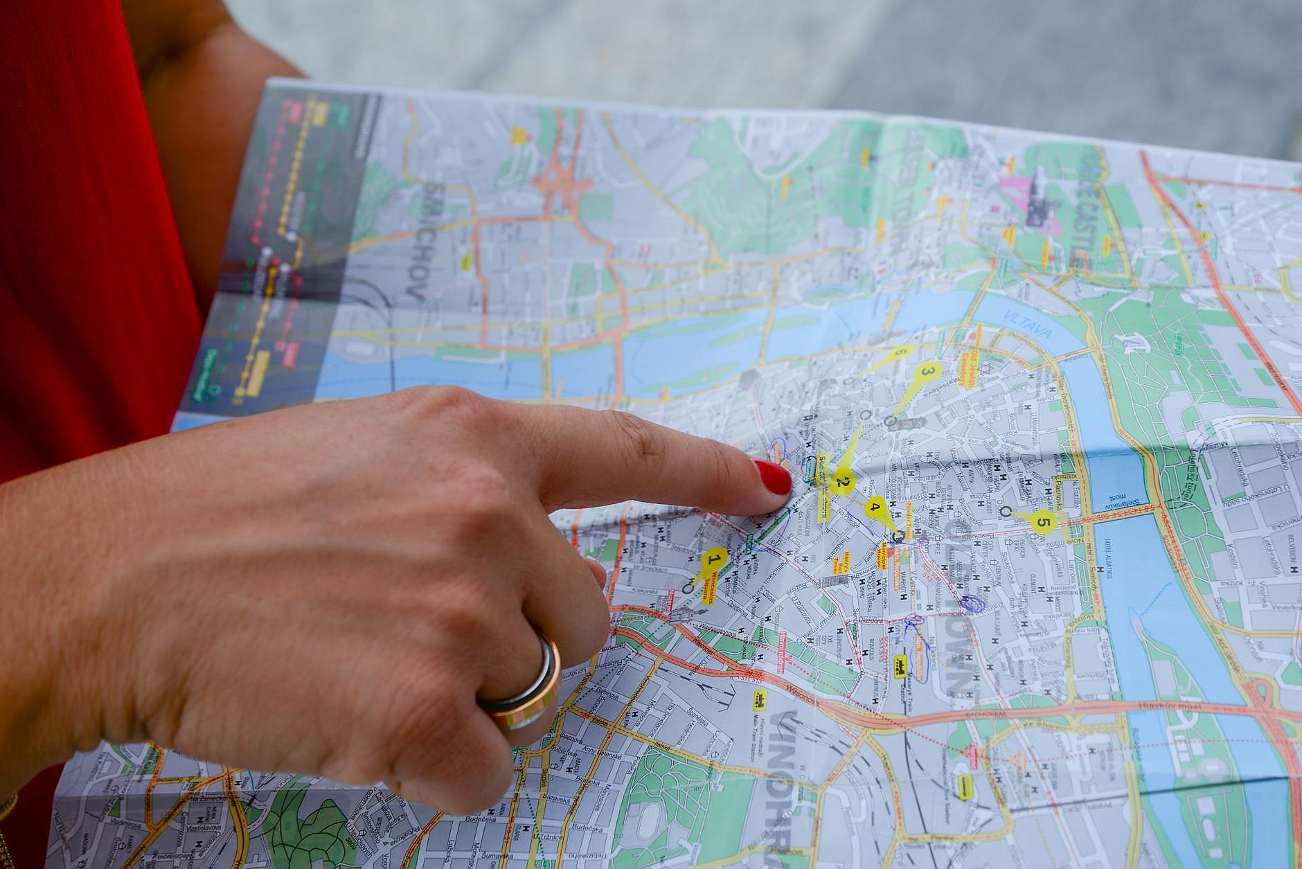 Tourist reviewing a map of Malta in St Julian's